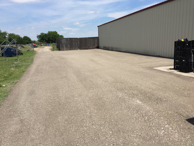 Recycled asphalt parking lot for metal building shop in North Texas 