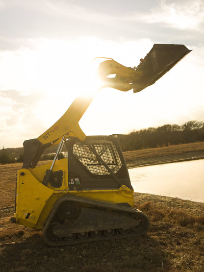 Beautiful Country Day with the loader - erosion control & pond repair in Princeton, Tx.